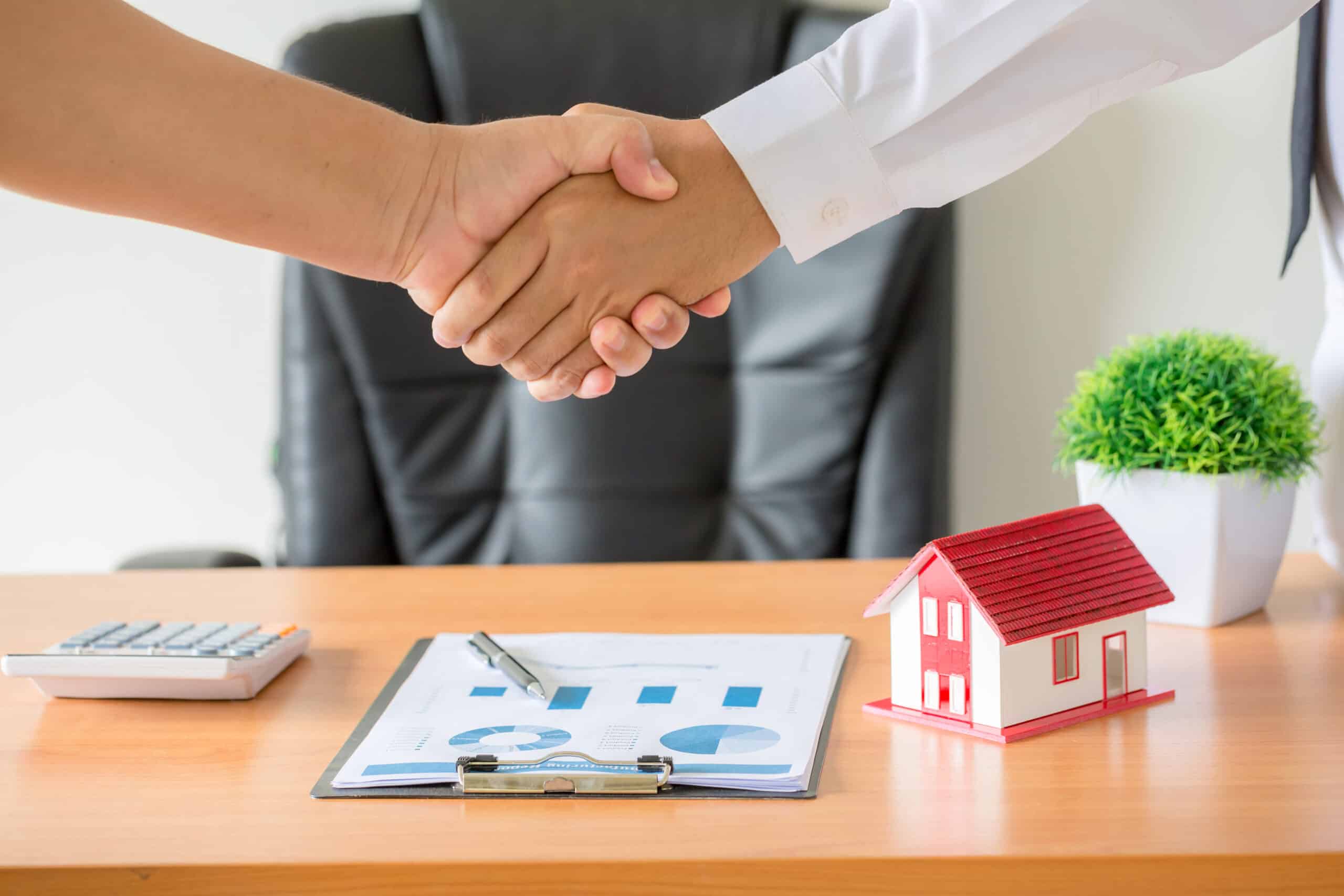 hands agent client shaking hands after signed contract buy new apartment scaled - Property Tax Arrears Solutions