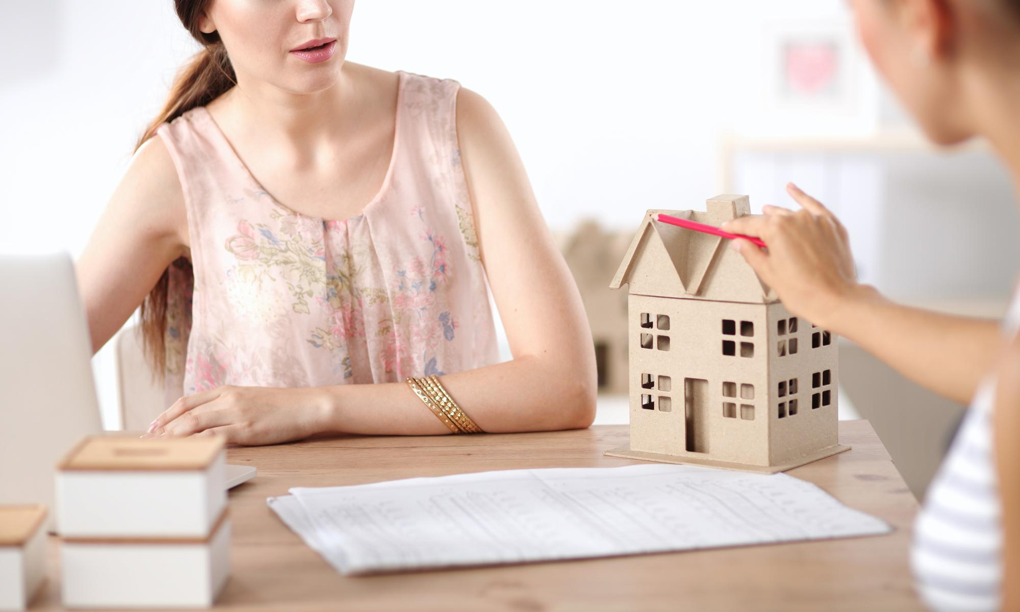 attractive businesswoman sitting office businesswoman - Secured Line of Credit (HELOC)