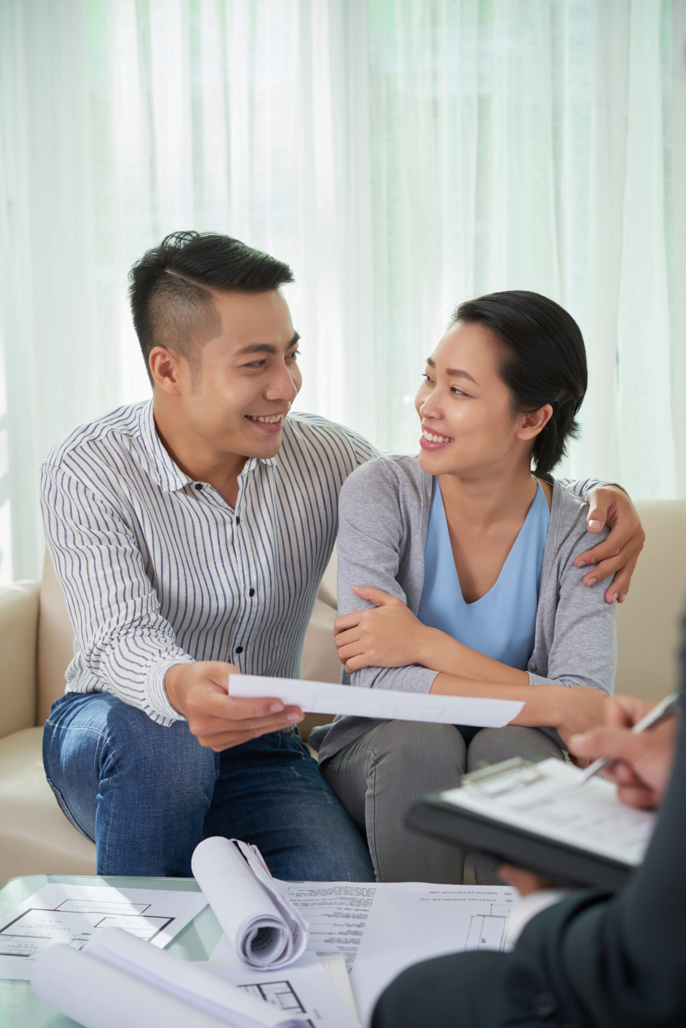 couple meeting estate broker - Bad Credit Mortgages in Canada