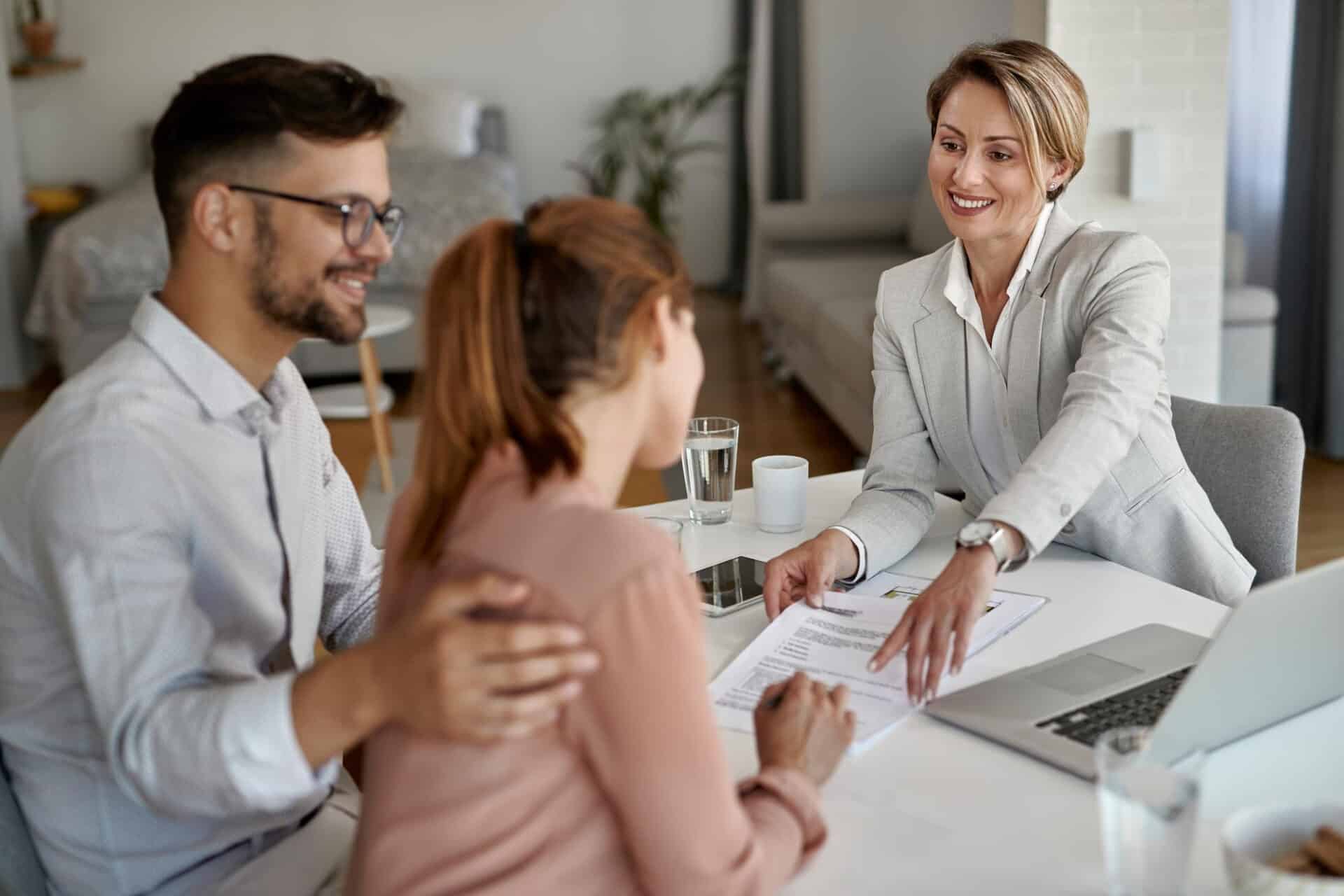 happy real estate agent having meeting with young couple pointing place signature their contract 1 - Home Equity Loans While In Consumer Proposal or Bankruptcy