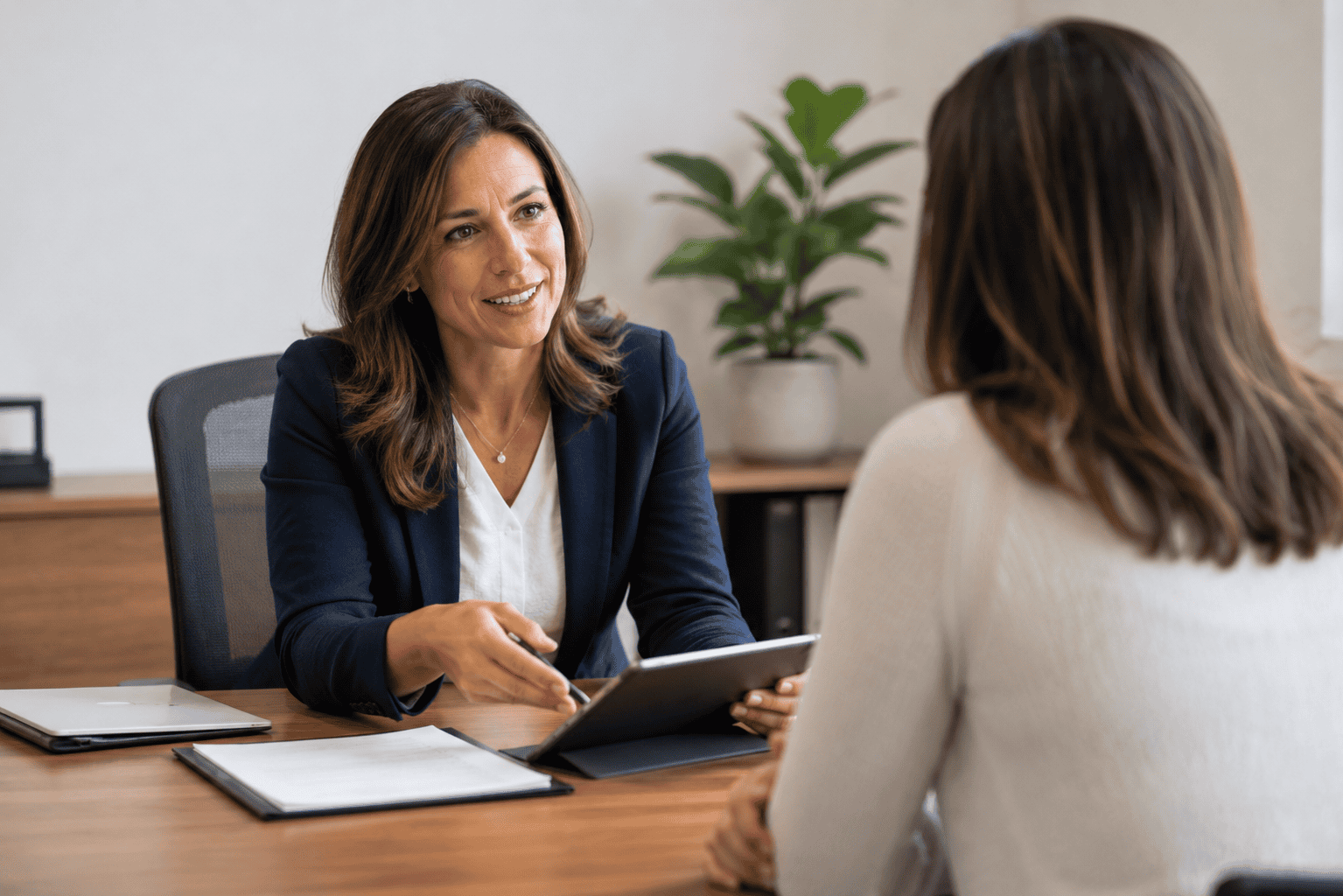 Mortgage broker reviewing bad credit mortgage paperwork with an Ontario homeowner across a desk